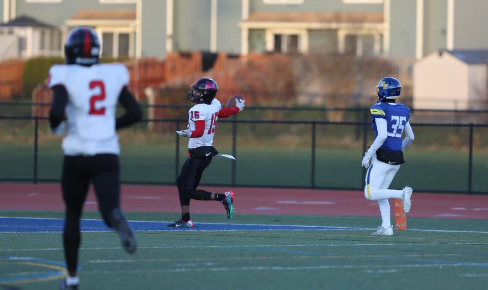 Monroe's Amari Colon Brown runs into the end zone after catching a 58-yard touchdown pass during the first half of their semifinal game at Cicero-North Syracuse High School.