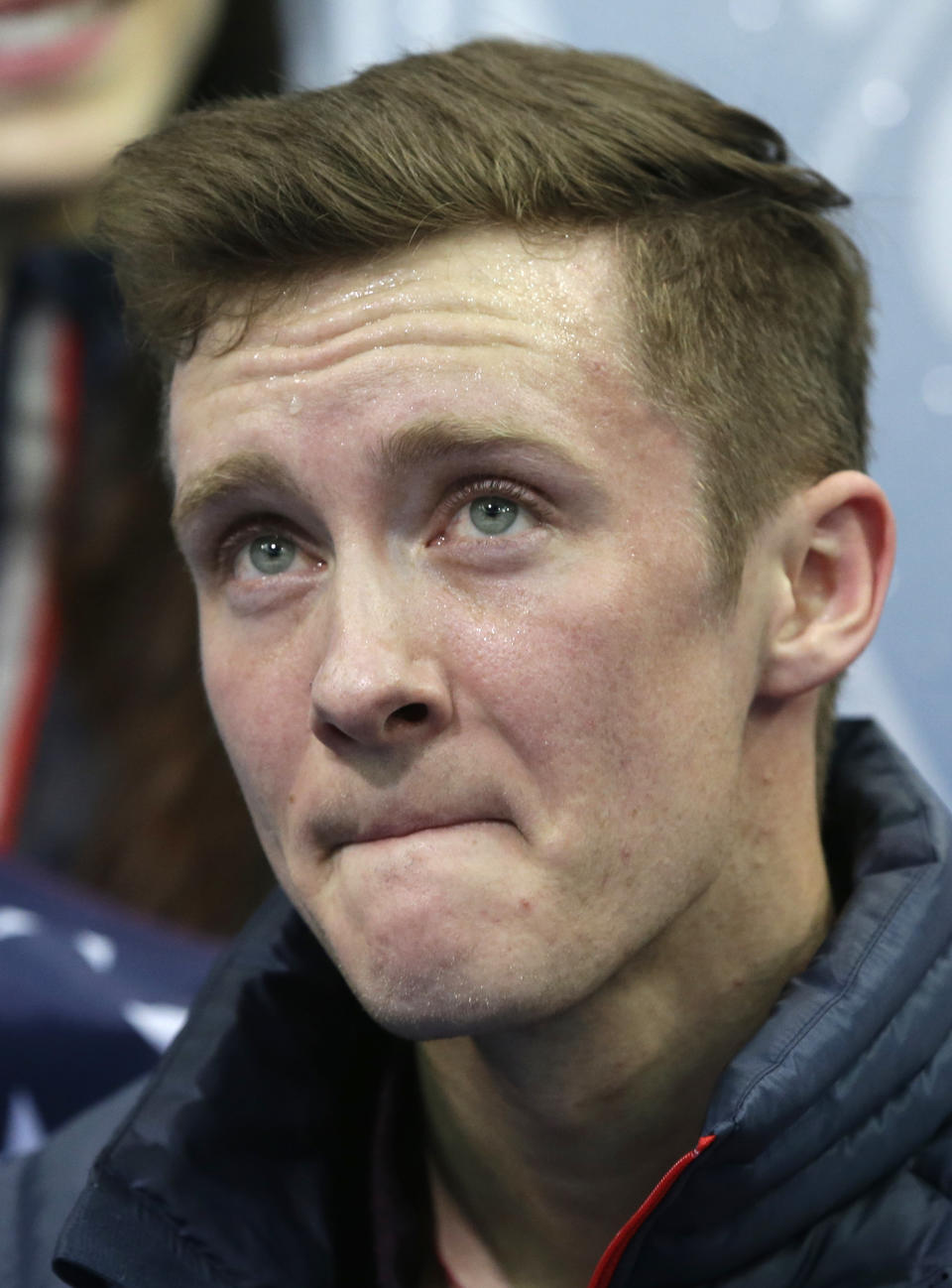 Jeremy Abbott of the United States waits for his results after competing in the men's team short program figure skating competition at the Iceberg Skating Palace during the 2014 Winter Olympics, Thursday, Feb. 6, 2014, in Sochi, Russia. (AP Photo/Darron Cummings, Pool)