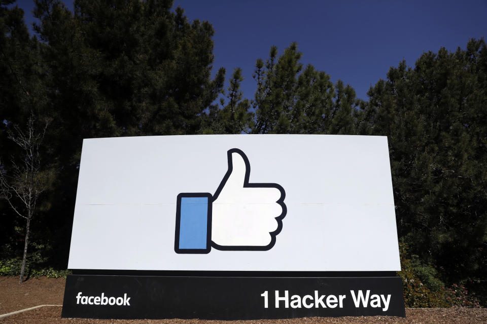 FILE - This March 28, 2018, file photo shows a Facebook logo at the company's headquarters in Menlo Park, Calif. Facebook’s ambitious plan to create a new financial system based on a digital currency faces questions from lawmakers, as it’s shadowed by negative comments from President Donald Trump, his Treasury secretary and the head of the Federal Reserve. (AP Photo/Marcio Jose Sanchez, File)