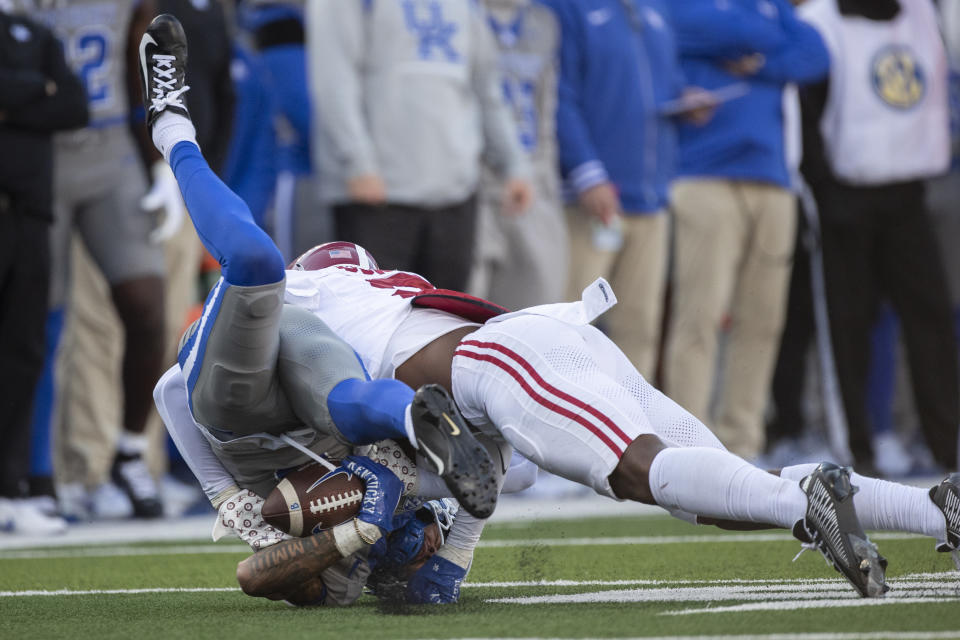 Alabama defensive back Caleb Downs (2) tackles Kentucky wide receiver Dane Key (6) during the second half of an NCAA college football game in Lexington, Ky., Saturday, Nov. 11, 2023. (AP Photo/Michelle Haas Hutchins)