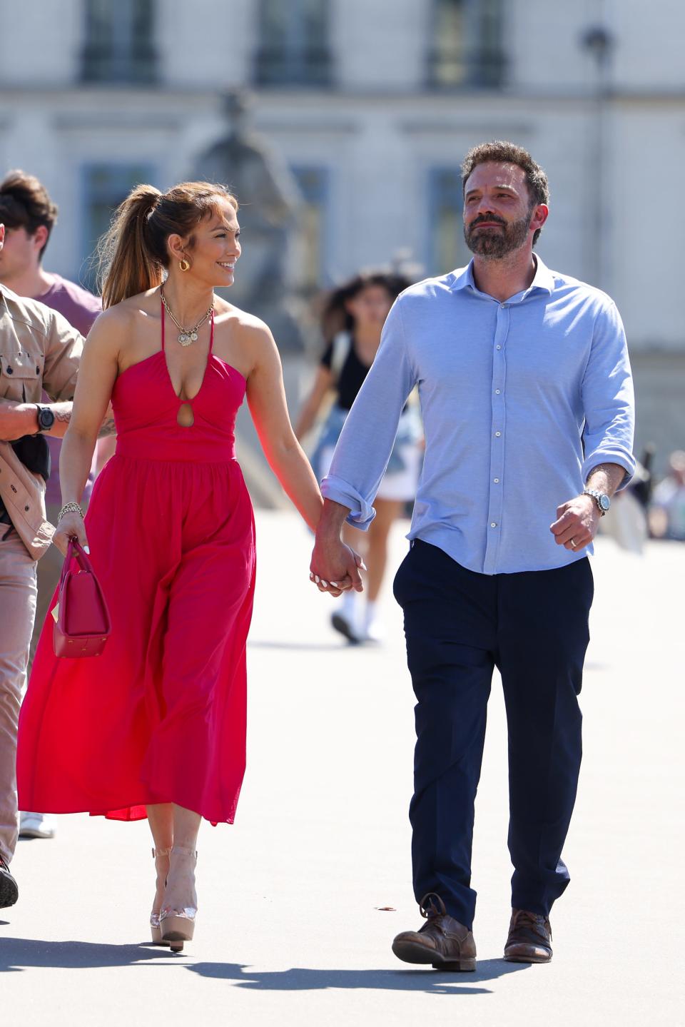 Jennifer Lopez and Ben Affleck strolling near the Louvre Museum in Paris, France.