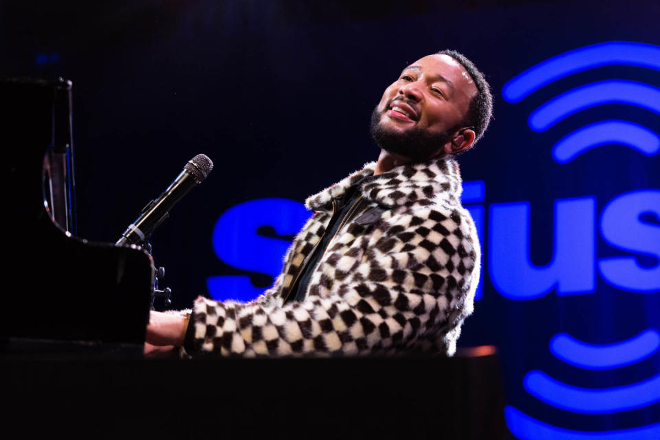 <p>John Legend takes his seat at the piano for SiriusXM's Small Stage Series presented by American Express at the El Rey Theatre in Los Angeles on Sept. 28. </p>