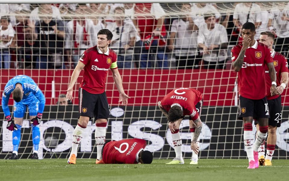 Players of Manchester United react after Loic Bade of Sevilla FC goal during the UEFA Europa League quarterfinal second leg match between Sevilla FC and Manchester United - Getty Images