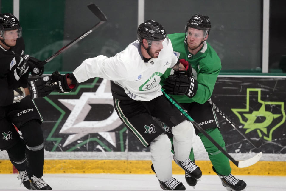 Dallas Stars center Tyler Seguin (91) skates against teammates center Radek Faksa (12) and defenseman John Klingberg (3) during an NHL hockey practice in Frisco, Texas, Thursday, Sept. 23, 2021. (AP Photo/LM Otero)