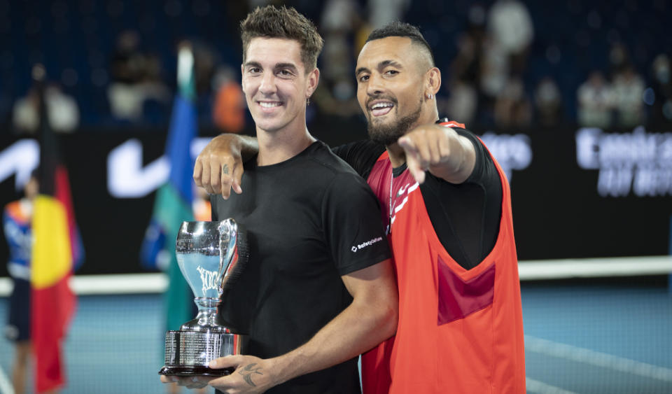 Thanasi Kokkinakis and Nick Kyrgios pose after their Australian Open men&#39;s doubles victory Credit: Alamy