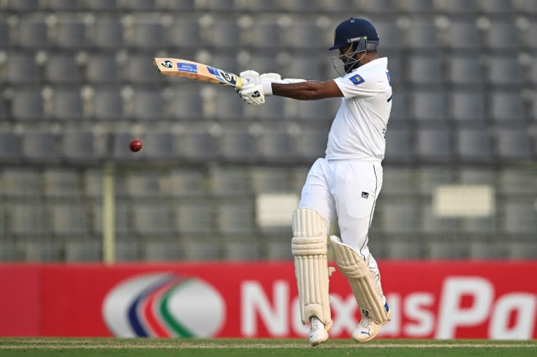 Sri Lanka's Dimuth Karunaratne held firm to score 52 off 101 balls before his dismissal off Shoriful Islam in the day's final session (MUNIR UZ ZAMAN)