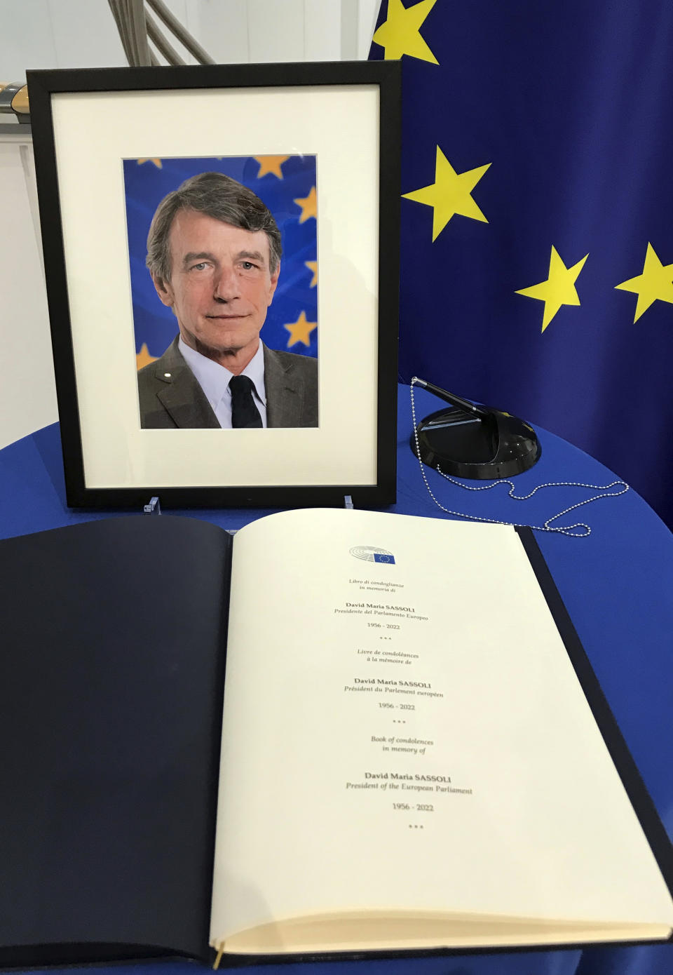 A condolence table with a register, in honour of European Parliament President David Sassoli, is set up at the European Parliament in Brussels, Tuesday, Jan. 11, 2022. David Sassoli, the Italian journalist who worked his way up in politics and became president of the European Union's parliament, died at a hospital in Italy early Tuesday, Jan. 11, 2022 his spokesperson said. (AP Photo/Mark Carlson)