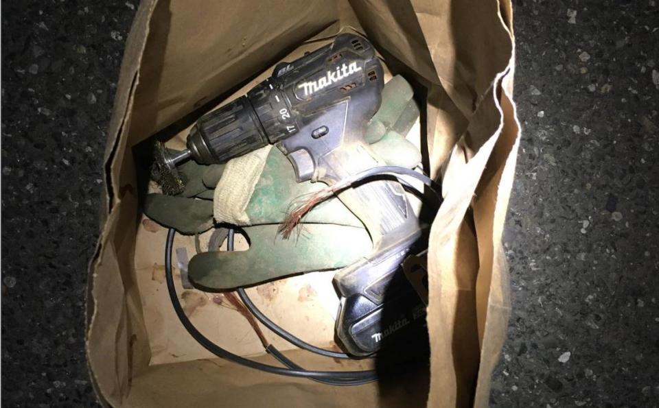 A brown paper bag containing rubber gloves, a piece of black insulated copper wire and a Makita drill were found when Whatcom County Sheriff’s deputies arrested two Bellingham women, Samantha Frances Brooks and Ellen Brennan Reiche, in late November 2020 for allegedly placing a shunt on a railroad track near Bellingham.