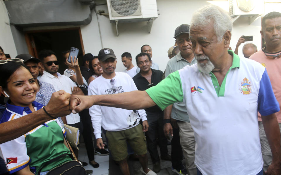 Leader of National Congress of the Reconstruction of East Timor (CNRT) party and former independence fighter Xanana Gusmao, right, greets supporters in Dili, East Timor, Tuesday, May 23, 2023. The country's opposition party won Sunday's parliamentary election, meaning that Gusmao is likely to return as prime minister in Asia's youngest democracy. (AP Photo/Lorenio L. Pereira)