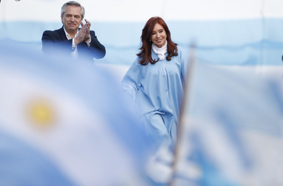 Presidential candidate Alberto Fernandez applauds as he arrives with his running mate Cristina Fernandez de Kirchner to their closing campaign rally, in Mar Del Plata, Argentina, Thursday, Oct. 24, 2019. Argentina will hold presidential elections on Sunday. (AP Photo/Natacha Pisarenko)