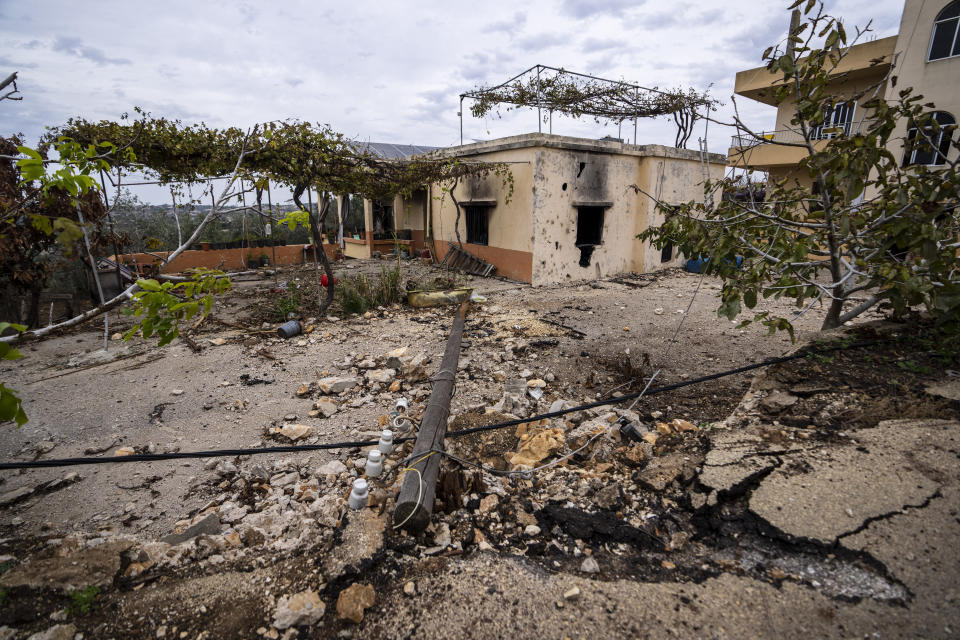 Debris of a damaged house that was hit by Israeli shelling is seen in the village of Dahaira, south Lebanona Lebanese border village with Israel, Lebanon, Saturday, Nov. 25, 2023. With a cautious calm prevailing over the border area in south Lebanon Saturday, the second day of a four-day cease-fire between Hamas and Israel, villages that had emptied of their residents came back to life at least briefly. (AP Photo/Hassan Ammar)