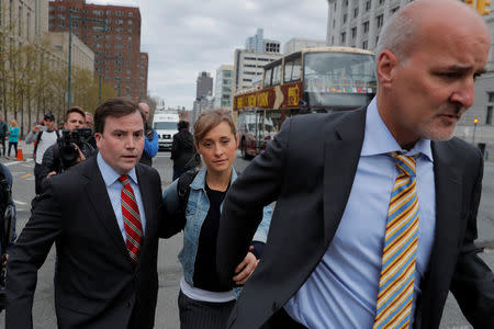 Actress Allison Mack, known for her role in the TV series "Smallville", departs after being granted bail following being charged with sex trafficking and conspiracy in New York, U.S., April 24, 2018. REUTERS/Lucas Jackson