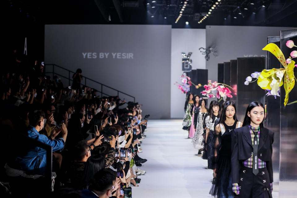 Models walk the runway during Shanghai Fashion Week spring 2023 season on Sept 24, 2022, in Shanghai, China. 