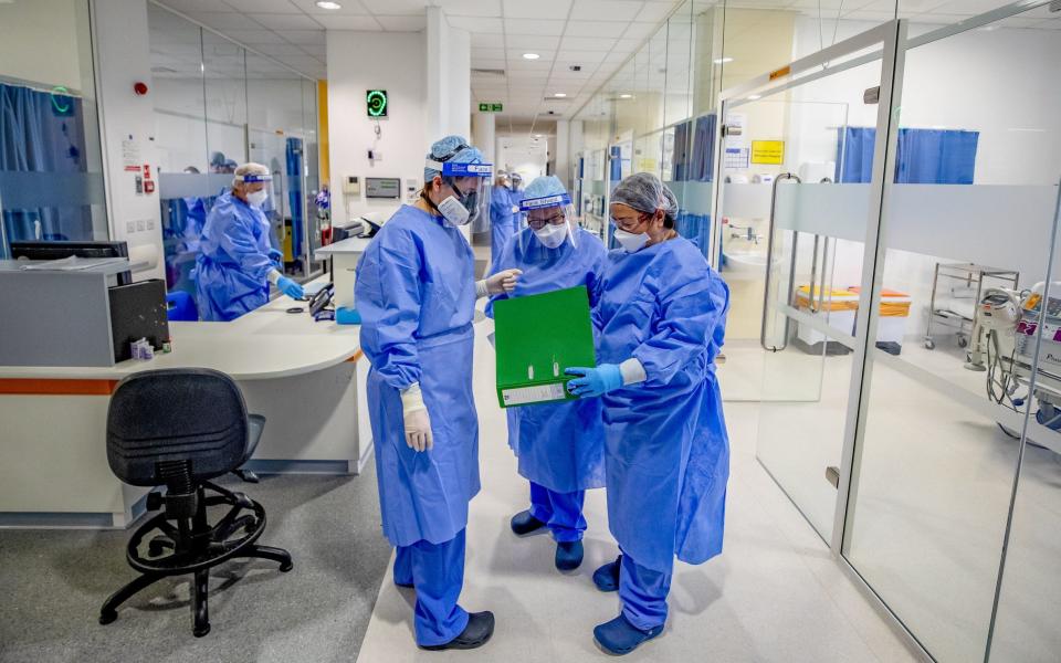 File photo dated 20/10/2020 of health workers wearing full personal protective equipment (PPE). The majority of doctors surveyed by a union still do not feel fully protected from coronavirus infection at work almost a year in to the pandemic. The British Medical Association (BMA) said its findings "tell a story of real worry" among medics. Issue date: Saturday February 13, 2021. PA Photo. The organisation, which has been regularly surveying doctors across the UK since April last year on their experiences and the issues they face in various settings, including GP practices and hospitals, said its latest results showed that just 28% feel fully protected at work. 