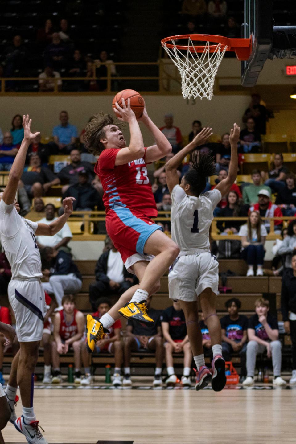 Shawnee Heights' Jaret Sanchez goes up for a basket against Piper in the quarterfinals at Emporia on Wednesday, March 6, 2024.