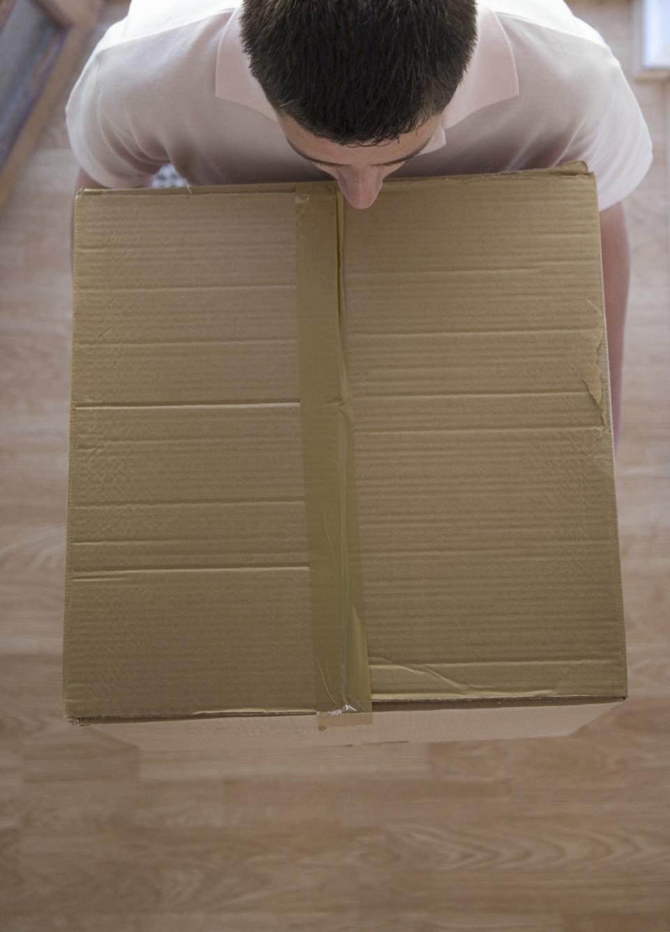 man carrying box