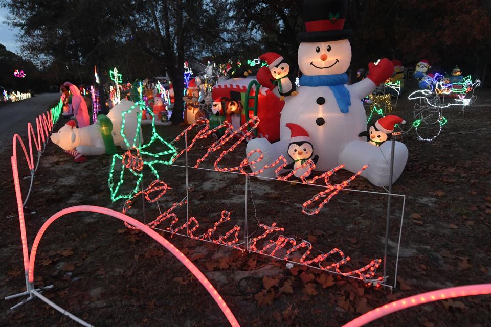The Melton family at 201 Melton Road has been decorating for the holidays for the past 19 years in Wilmington, N.C., December 1, 2021. Inflatables of all sizes and types fill up the huge yard off River Rd.      MATT BORN/STARNEWS