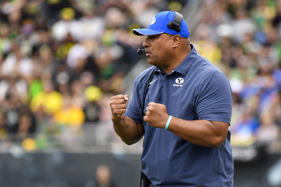 BYU head coach Kalani Sitake encourages his players as they try to mount a comeback against Oregon during the second half of an NCAA college football game, Saturday, Sept. 17, 2022, in Eugene, Ore. (AP Photo/Andy Nelson)