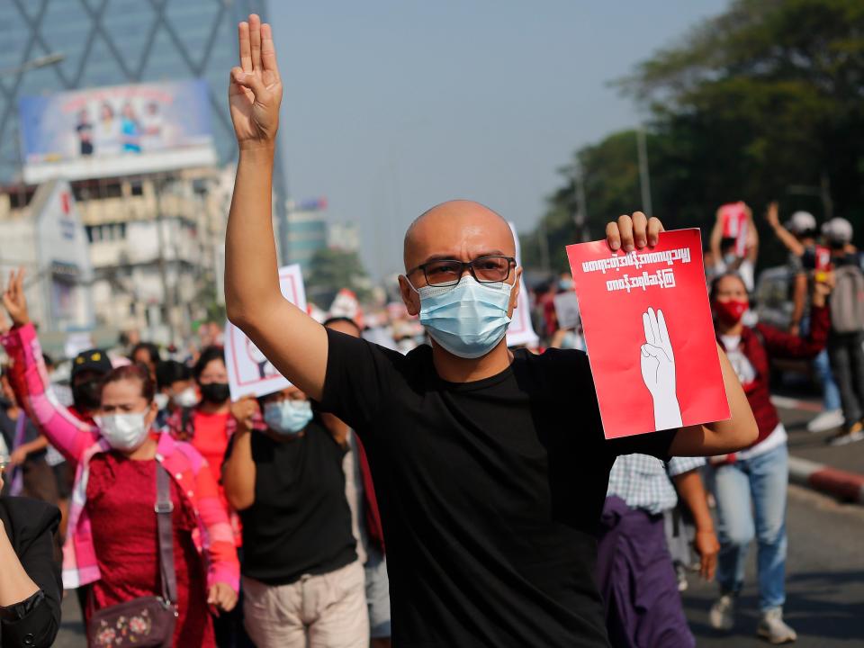 A Myanmar protester makes the three finger salute during a demonstration against military coup in Yangon, Myanmar on February 7, 2021. (Photo by Myat Thu Kyaw/NurPhoto via Getty Images)