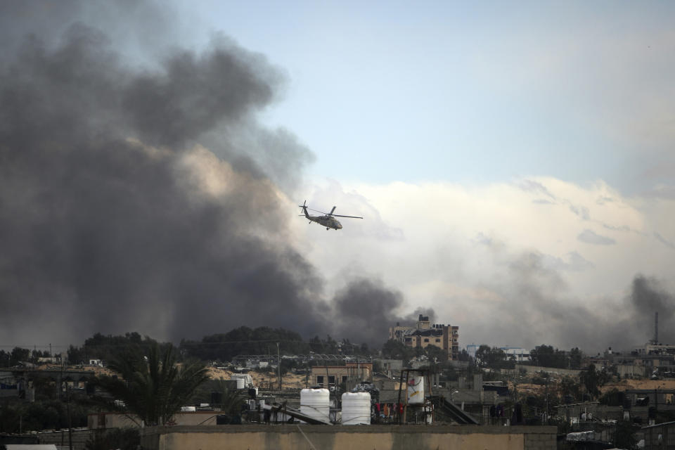 Israeli helicopter flies over Khan Younis, Gaza Strip, Thursday, Feb. 15, 2024. (AP Photo/Mohammed Dahman)