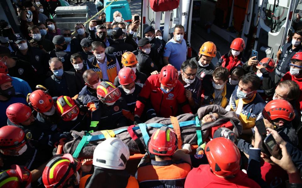 Three children and a mother are being rescued from the rubbles of collapsed Doganlar Apartment - Anadolu