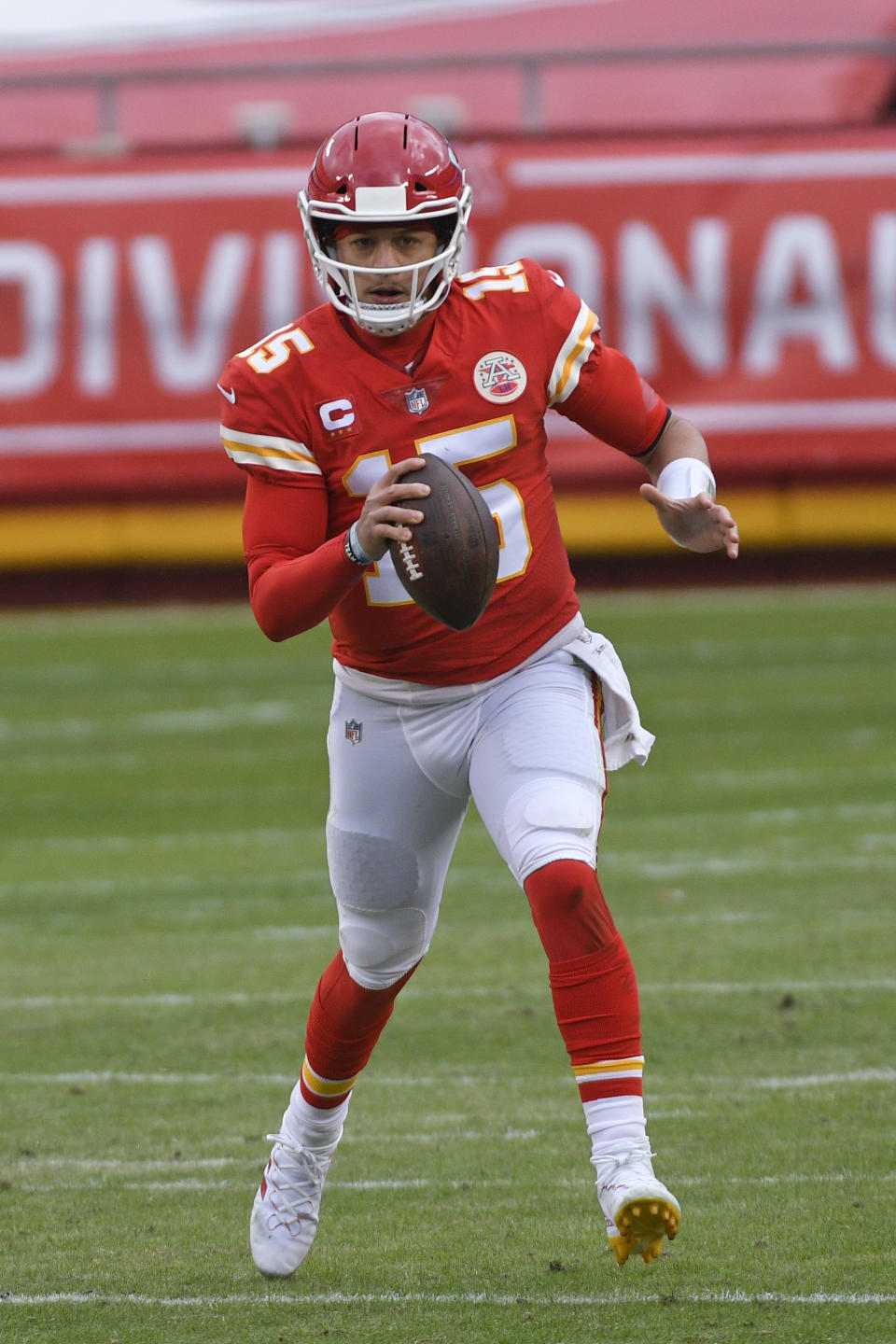 Kansas City Chiefs quarterback Patrick Mahomes scrambles up field during the first half of an NFL divisional round football game against the Cleveland Browns, Sunday, Jan. 17, 2021, in Kansas City. (AP Photo/Reed Hoffmann)