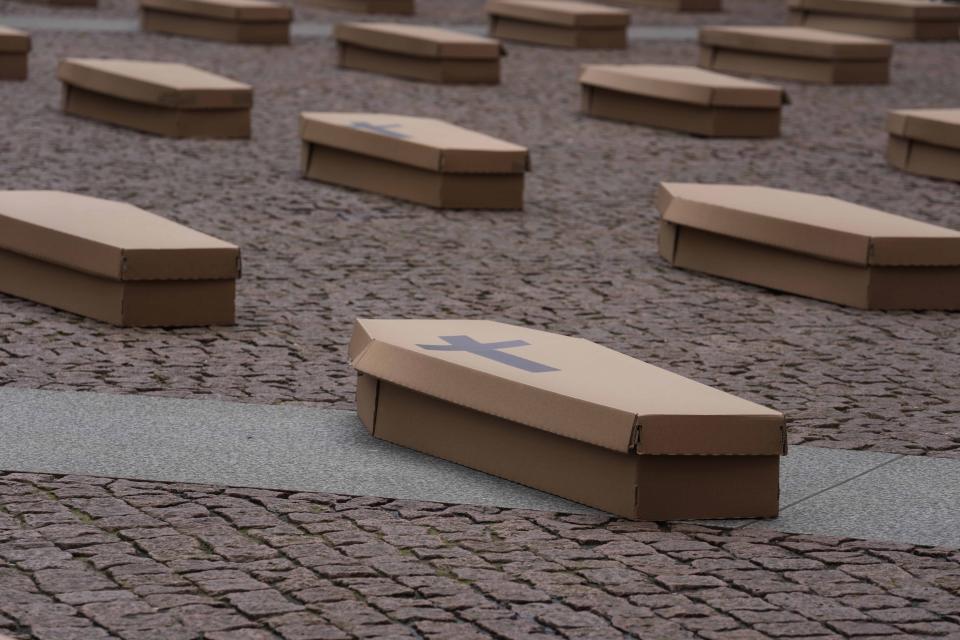 La Scala theatre square is filled with 172 coffins, as many as the number of deaths at work that Lombardy recorded in 2023, during a flash mob organised by UIL trade union organization, in Milan, Italy, Friday, May 10, 2024. (AP Photo/Luca Bruno)