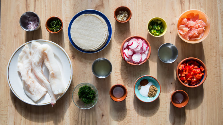 fish taco ingredients on table 