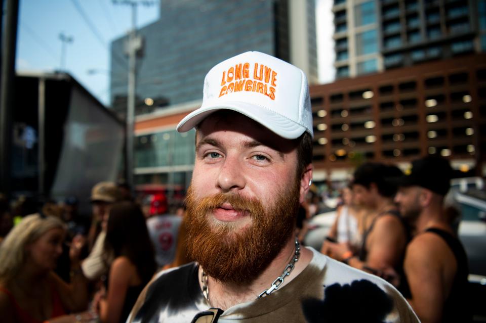 Ben Foley waits outside after the Hardy and Ernest’s Hixtape Party at Losers was delayed in Nashville , Tenn., Wednesday, Aug. 3, 2022.