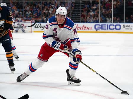 Oct 6, 2018; Buffalo, NY, USA; New York Rangers defenseman Brady Skjei (76) skates up ice with the puck during the first period against the Buffalo Sabres at KeyBank Center. Mandatory Credit: Kevin Hoffman-USA TODAY Sports