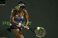 Mar 29, 2017; Miami, FL, USA; Venus Williams of the United States hits a backhand against Angelique Kerber of Germany (not pictured) on day nine of the 2017 Miami Open at Crandon Park Tennis Center. Williams won 7-5, 6-3. Geoff Burke-USA TODAY Sports