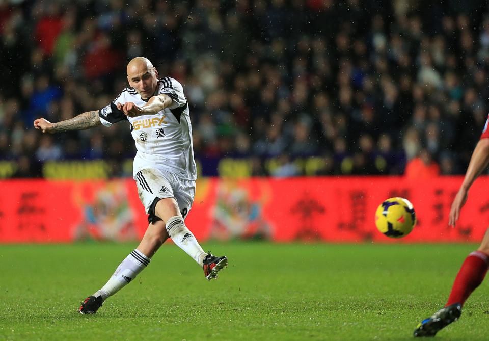 Swansea City's Jonjo Shelvey scores his side's first goal of the game during the English Premier League soccer match at the Liberty Stadium, Swansea, Wales, Tuesday, Jan. 28, 2014. (AP Photo/Nick Potts, PA Wire) UNITED KINGDOM OUT - NO SALES - NO ARCHIVES