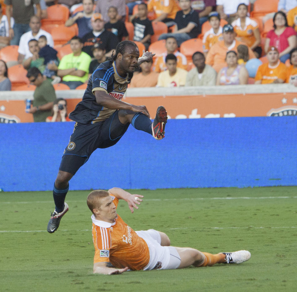 HOUSTON, TX - JUNE 30: Jorge Perlaza #16 of the Philadelphia Union shoots over a block attempt by Andre Hainault #31 of the Houston Dynamo at BBVA Compass Stadium on June 30, 2012 in Houston, Texas. (Photo by Bob Levey/Getty Images)