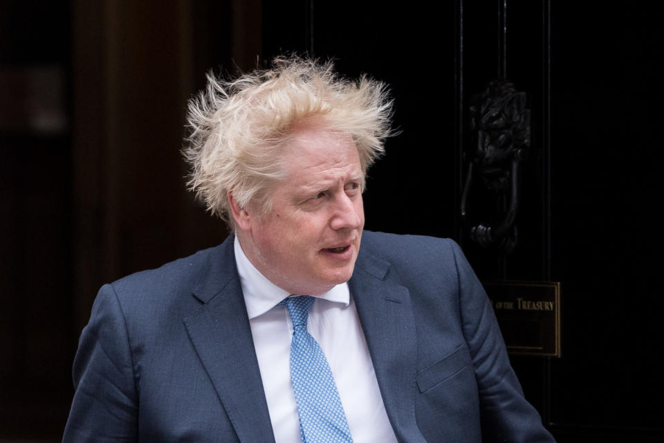 LONDON, UNITED KINGDOM - APRIL 19, 2022: British Prime Minister Boris Johnson steps out from 10 Downing Street to welcome Prime Minister of Kurdistan Region, Masrour Barzani (not pictured) ahead of their bilateral meeting on April 19, 2022 in London, England. (Photo credit should read Wiktor Szymanowicz/Future Publishing via Getty Images)