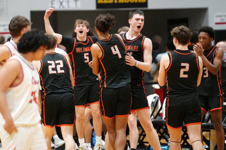 Delaware Hayes celebrates after beating Olentangy Orange 74-56 in the Division I regional final Saturday at Ohio Dominican.