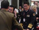 Sun Jianguo (R) from the Chinese PLA Navy, attends US Secretary of Defense Ashton Carter's speech during the 14th Asia Security Summit in Singapore on May 30, 2015