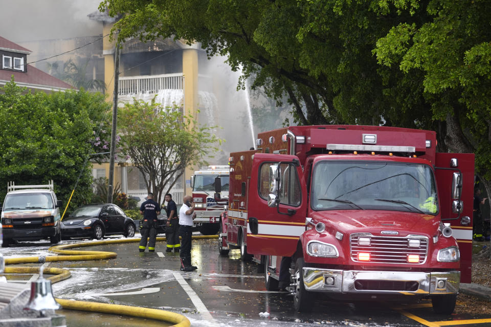 City of Miami Fire Rescue firefighters work at the scene of a fire at the Temple Court apartments Monday, June 10, 2024, in Miami. (AP Photo/Lynne Sladky)