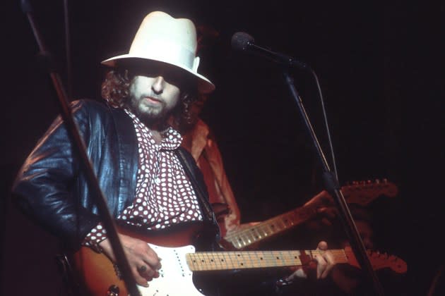 Bob Dylan performs on stage with a Fender Stratocaster electric guitar at 'The Last Waltz' concert at Winterland Ballroom on November 25, 1976 in San Francisco, California. - Credit: Michael Ochs Archives/Getty Images