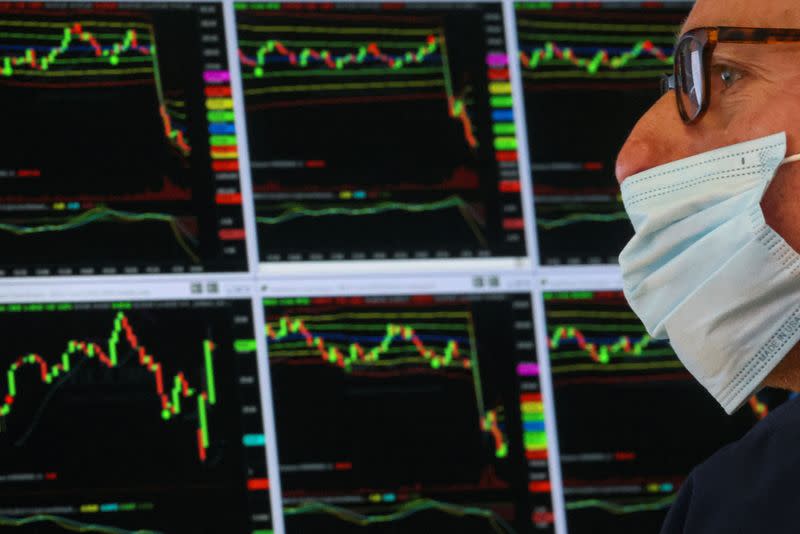 Traders work on the floor of the NYSE in New York