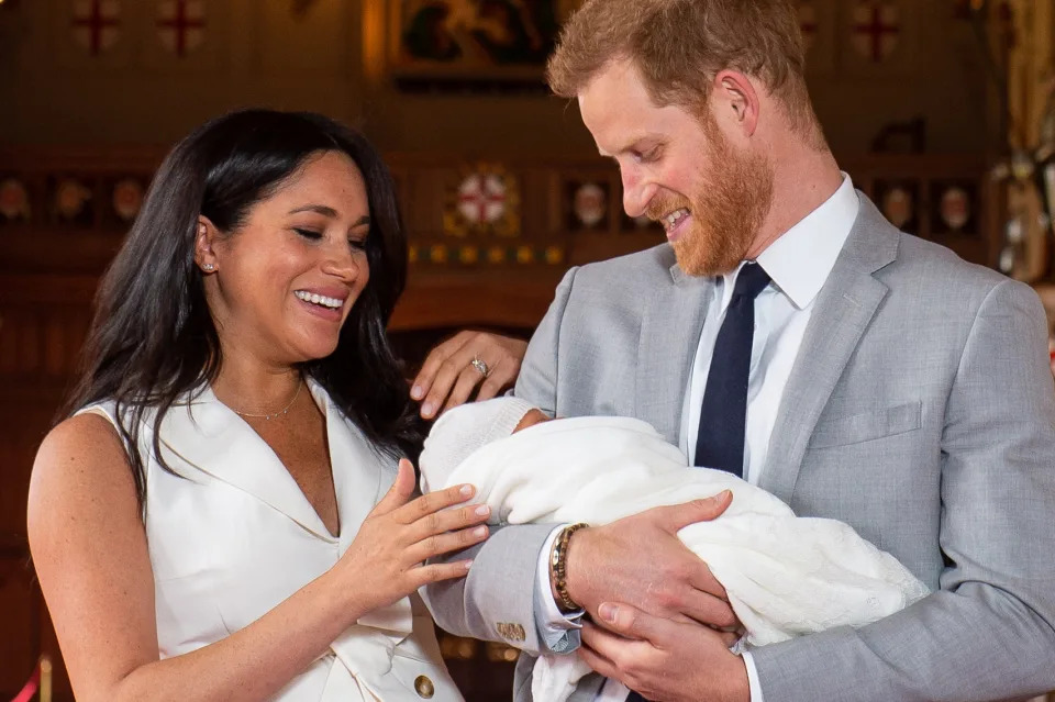 Prince Harry and Meghan Markle with their newborn baby son, Prince Archie Harrison Mountbatten-Windsor, in St George's Hall at Windsor Castle in Windsor on May 8, 2019