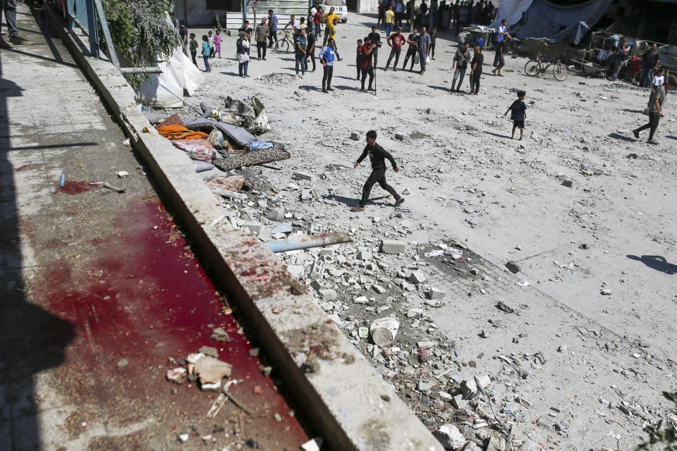 Blood can be seen in the aftermath of the Israeli strike on a U.N.-run school that killed dozens of Palestinians in the Nusseirat refugee camp in the Gaza Strip, Thursday, June 6, 2024. The Israeli military said that Hamas militants were operating from within the school. (AP Photo/Jehad Alshrafi)