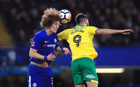 Chelsea's David Luiz (left) and Norwich City's Nelson Oliveira - Credit: PA