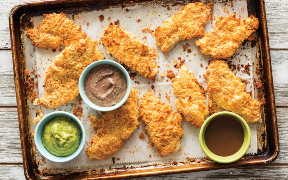 <p>MARK BOUGHTON PHOTOGRAPHY / STYLING BY TERESA BLACKBURN</p><p>Oven-baked tenders and a trio of sauces are perfect for a speedy supper.</p><p><strong>Get the recipe: <a href="https://parade.com/864528/parade/crispy-baked-chicken-dippers/" rel="nofollow noopener" target="_blank" data-ylk="slk:Crispy Baked Chicken Dippers;elm:context_link;itc:0;sec:content-canvas" class="link ">Crispy Baked Chicken Dippers</a></strong></p>