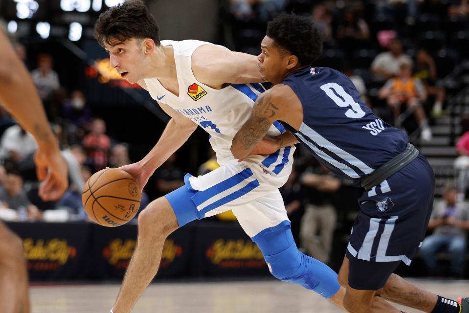 Thunder forward Chet Holmgren (7) dribbles past Grizzlies guard Ronaldo Segu (9) during an NBA summer league basketball game on July 6 in Salt Lake City.