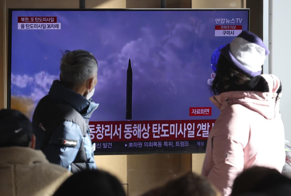 People watch a TV screen showing a news program about North Korea's missile launch with file footage, at the Seoul Railway Station in Seoul, South Korea, Sunday, Dec. 18, 2022. North Korea fired a pair of ballistic missiles on Sunday toward its eastern waters, its first weapons test in a month and coming two days after it claimed to have performed a key test needed to build a more mobile, powerful intercontinental ballistic missile designed to strike the U.S. mainland. (Shin Jun-hee/Yonhap via AP)