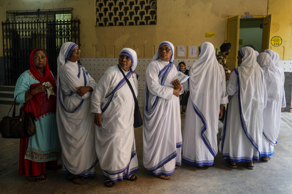 FILE-Nuns of the Missionaries of Charity, the order founded by Saint Teresa, stand in queue to cast their votes during the last round of a six-week-long national election, in Kolkata, India, Saturday, June 1, 2024. (AP Photo/Bikas Das, file)