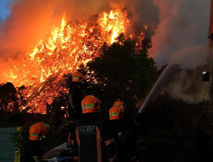 SCDF personnel fighting the fire at Lorong Semangka (PHOTO: SCDF/Facebook)