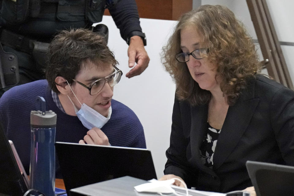 Marjory Stoneman Douglas High School shooter Nikolas Cruz speaks with Assistant Public Defender Tamara Curtis during jury selection in the penalty phase of his trial at the Broward County Courthouse in Fort Lauderdale, Fla., on Wednesday, May 25, 2022. Cruz, pleaded guilty in October to 17 counts of first-degree murder and to the wounding of 17 others. The trial will decide whether Cruz is sentenced to death or life in prison without parole.(Amy Beth Bennett/South Florida Sun-Sentinel via AP, Pool)