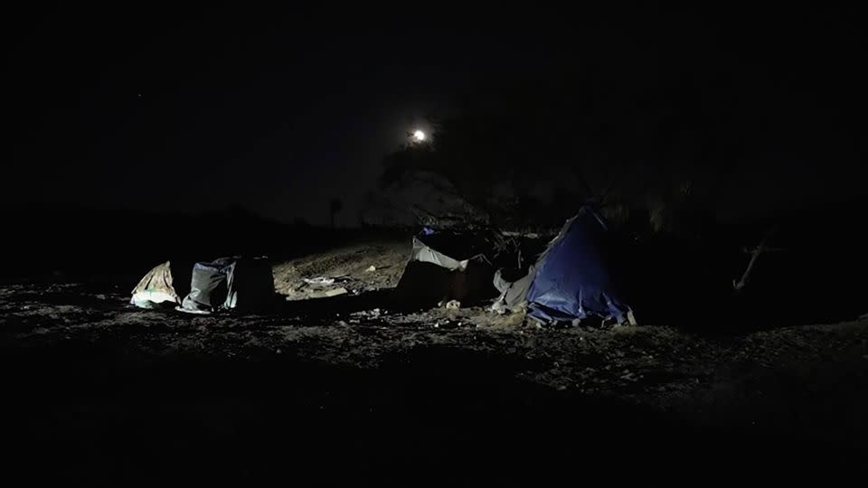 Tents and trash are seen on the Shusters' property left behind by migrants. - CNN