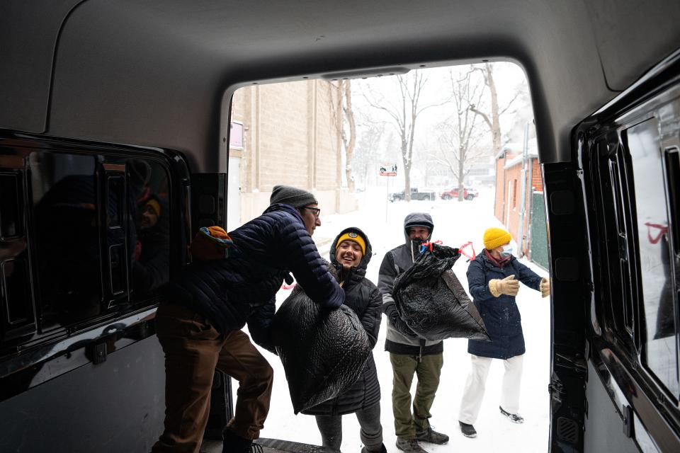 Eli Kolodny and Chloe Cochran with O’Dell Brewing help load bags of donated clothes into a van during the Martin Luther King Day 'Day of Service' at the Lincoln Center in Fort Collins, Colo., on Monday, Jan. 15, 2024. The event is for the benefit of Homeward Alliance.